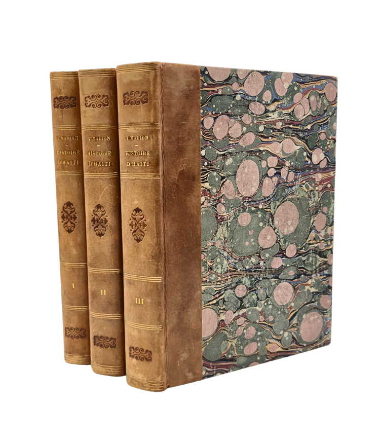 Presentation copy of the first complete history of Haiti, by a Haitian and published in Haiti by a man of colour